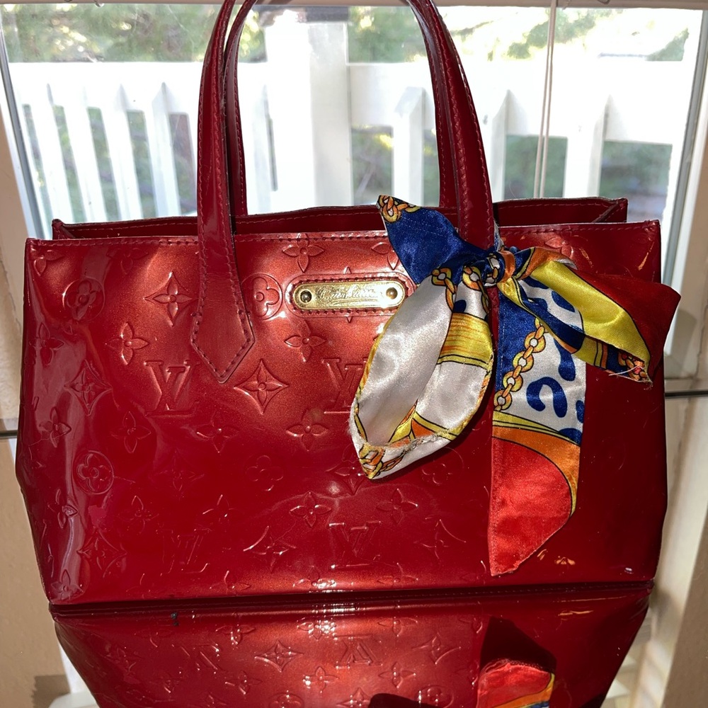 Luis Vuitton Red Bag With Lock And Key - image 1
